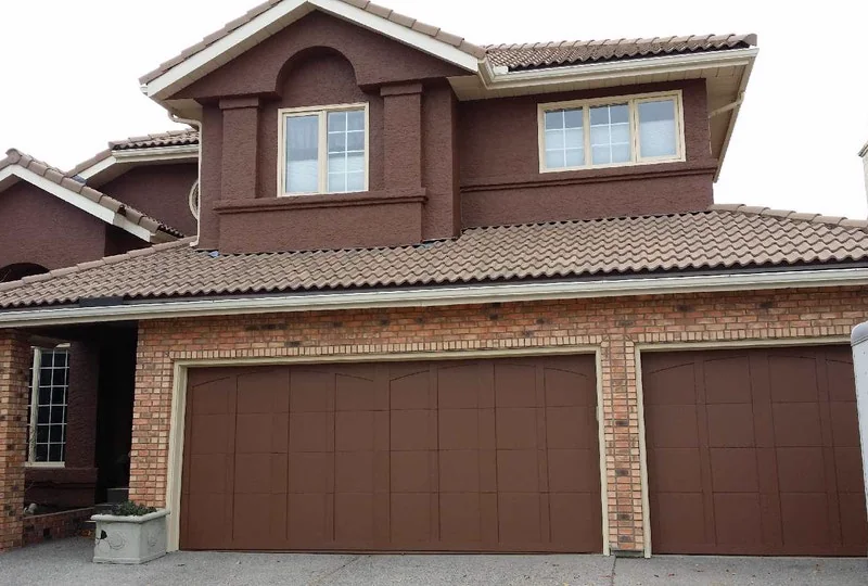 Freshly repainted brick-and-stucco home exterior in Calgary