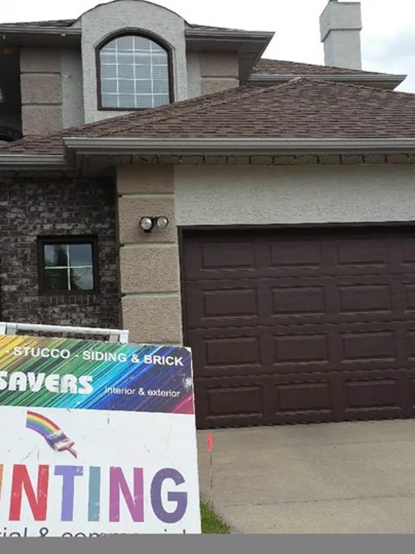 Life Saver Painting on site at a Calgary home — stucco, siding & brick